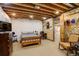 Finished basement bedroom featuring wood accent wall, bed, and ample space at 21270 E Eldorado Dr, Aurora, CO 80013