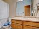 Standard bathroom with a vanity, sink, toilet, and shower-tub combination with a patterned curtain at 21270 E Eldorado Dr, Aurora, CO 80013