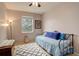 This bedroom features a light fixture, window and a comfortable bed at 21270 E Eldorado Dr, Aurora, CO 80013