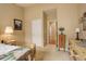 This bedroom features neutral walls, carpet, rustic furniture, and ample sunlight at 21270 E Eldorado Dr, Aurora, CO 80013