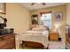 Bedroom with a bed, dresser, and window providing natural light at 21270 E Eldorado Dr, Aurora, CO 80013