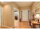 Welcoming entryway featuring hardwood floors and view into a sitting room with a piano at 21270 E Eldorado Dr, Aurora, CO 80013