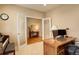 Bright office space with hardwood floors, glass french doors, and a comfortable workspace at 21270 E Eldorado Dr, Aurora, CO 80013