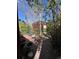 Private backyard patio with brick paving, mature trees and outdoor decor at 231 W Ellsworth Ave, Denver, CO 80223