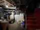 Unfinished basement with exposed ductwork, laundry area featuring a washer and dryer, and potential for customization at 231 W Ellsworth Ave, Denver, CO 80223