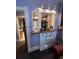 Charming hallway featuring a built-in cabinet with decorative moldings, offering storage and a vintage touch at 231 W Ellsworth Ave, Denver, CO 80223