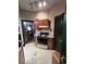 Cozy kitchen with vintage cabinets, white countertop, linoleum flooring, and a range at 231 W Ellsworth Ave, Denver, CO 80223