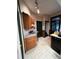 Functional kitchen with wooden cabinets, laminate countertops, and modern appliances, ready for your culinary creations at 231 W Ellsworth Ave, Denver, CO 80223