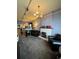 Bright living room with a decorative fireplace, leather armchairs and an elegant chandelier at 231 W Ellsworth Ave, Denver, CO 80223
