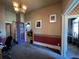 Vintage office space with period wallpaper and chandelier featuring three doorways that allow for easy access and flow at 231 W Ellsworth Ave, Denver, CO 80223