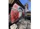 Cozy porch with an ornate iron bench and beautiful view of the house number at 231 W Ellsworth Ave, Denver, CO 80223