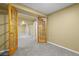 Basement with plush carpet and french doors leading to additional spaces at 9814 Norfolk St, Commerce City, CO 80022