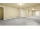 Spacious finished basement with neutral paint and plush carpet at 9814 Norfolk St, Commerce City, CO 80022