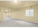 Finished basement with neutral paint, plush carpet and natural light from the windows at 9814 Norfolk St, Commerce City, CO 80022