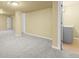 Finished basement with neutral carpet and paint and laundry hookups at 9814 Norfolk St, Commerce City, CO 80022
