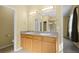 Bathroom with double sinks, large mirror and vanity at 9814 Norfolk St, Commerce City, CO 80022