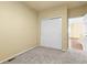 Bedroom featuring gray carpet, neutral paint and closet at 9814 Norfolk St, Commerce City, CO 80022