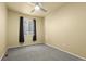 Bedroom featuring gray carpet, neutral paint and window at 9814 Norfolk St, Commerce City, CO 80022