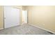 Bedroom featuring gray carpet, neutral paint and closet at 9814 Norfolk St, Commerce City, CO 80022