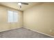 Bedroom featuring gray carpet, neutral paint and ceiling fan at 9814 Norfolk St, Commerce City, CO 80022
