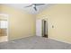 Bedroom featuring gray carpet, neutral paint and attached bathroom at 9814 Norfolk St, Commerce City, CO 80022