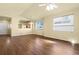 Bright living room with hardwood floors, natural light, and easy access to dining and kitchen areas at 9814 Norfolk St, Commerce City, CO 80022