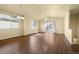 Bright living room with a ceiling fan, hardwood floors and access to backyard at 9814 Norfolk St, Commerce City, CO 80022