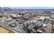 Wide aerial view of apartment building in a city neighborhood with nearby amenities at 2899 N Speer Blvd # 203, Denver, CO 80211