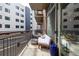 Cozy balcony with comfortable seating, throw pillows, and city views at 2899 N Speer Blvd # 203, Denver, CO 80211