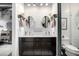 Modern bathroom with double vanity, subway tile backsplash, circular mirrors, and stylish fixtures at 2899 N Speer Blvd # 203, Denver, CO 80211