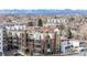 Brick apartment building with balconies, patios and mature landscaping; close to amenities and traffic at 2899 N Speer Blvd # 203, Denver, CO 80211