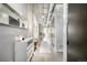 Industrial-style hallway with concrete floors, exposed ducts, and a stylish console table with decor at 2899 N Speer Blvd # 203, Denver, CO 80211