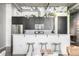 Stylish kitchen featuring stainless steel appliances, white countertops, and overhead lighting at 2899 N Speer Blvd # 203, Denver, CO 80211