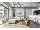 Spacious living room with large windows, modern furniture, and an open concept design at 2899 N Speer Blvd # 203, Denver, CO 80211