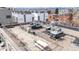 Inviting rooftop patio with stone tile, tables, chairs, grill, and mountain views at 2899 N Speer Blvd # 203, Denver, CO 80211
