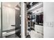Walk-in closet with custom shelving, drawers, plenty of hanging space, and a full length mirror at 2899 N Speer Blvd # 203, Denver, CO 80211