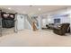 Spacious finished basement with room for recreation and relaxation, plus access to the upper floor at 10089 Wynwood Way, Highlands Ranch, CO 80126