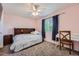 Cozy bedroom with a ceiling fan, carpet, and natural light from the window at 10089 Wynwood Way, Highlands Ranch, CO 80126
