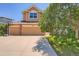 Charming home featuring a two-car garage and a well-manicured front yard at 10089 Wynwood Way, Highlands Ranch, CO 80126