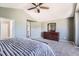 Cozy main bedroom with plush carpeting, a dresser with a mirror, and ample space for relaxation at 10089 Wynwood Way, Highlands Ranch, CO 80126