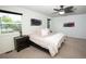 Inviting bedroom featuring neutral carpet, a ceiling fan, and plenty of natural light at 1775 S Memphis St, Aurora, CO 80017