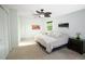 Bright bedroom with a ceiling fan, neutral carpet, and ample natural light at 1775 S Memphis St, Aurora, CO 80017