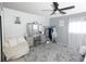 Fashionable bedroom featuring a seating area, ample storage, and lots of natural light at 1775 S Memphis St, Aurora, CO 80017