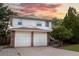 Charming two-story home featuring a brick-accented two-car garage and a well-manicured lawn at 1775 S Memphis St, Aurora, CO 80017