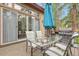 Backyard patio with seating, grill, and sliding doors at 171 Columbine St, Larkspur, CO 80118