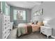Bedroom features warm colors, soft carpet, a large window, and dresser at 171 Columbine St, Larkspur, CO 80118