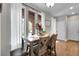Charming dining area with a wooden table, cushioned chairs, and natural light at 171 Columbine St, Larkspur, CO 80118