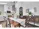 Dining room showcasing seamless flow to the living room and backyard views at 171 Columbine St, Larkspur, CO 80118