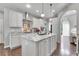 Modern kitchen with granite countertops, stainless steel appliances, and a center island at 171 Columbine St, Larkspur, CO 80118