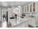 Bright kitchen featuring granite counters, white cabinets, and stainless-steel appliances at 171 Columbine St, Larkspur, CO 80118